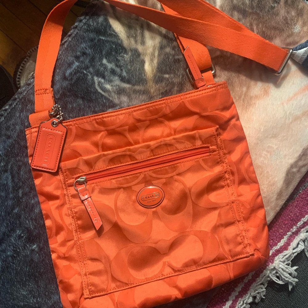 Coach Orange Crossbody Bag with Quilted Design and Adjustable Strap